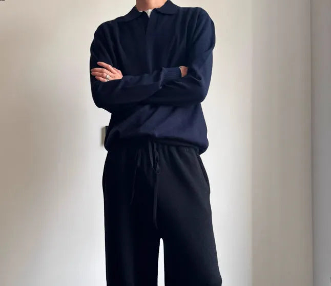 Man's pure wool polo sweater with a lapel collar in a loose fit, shown in navy blue.