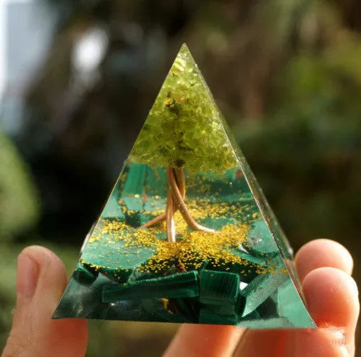 Clear epoxy resin pyramid ornament with embedded coloured crystal gravel inside, measuring 6cm.