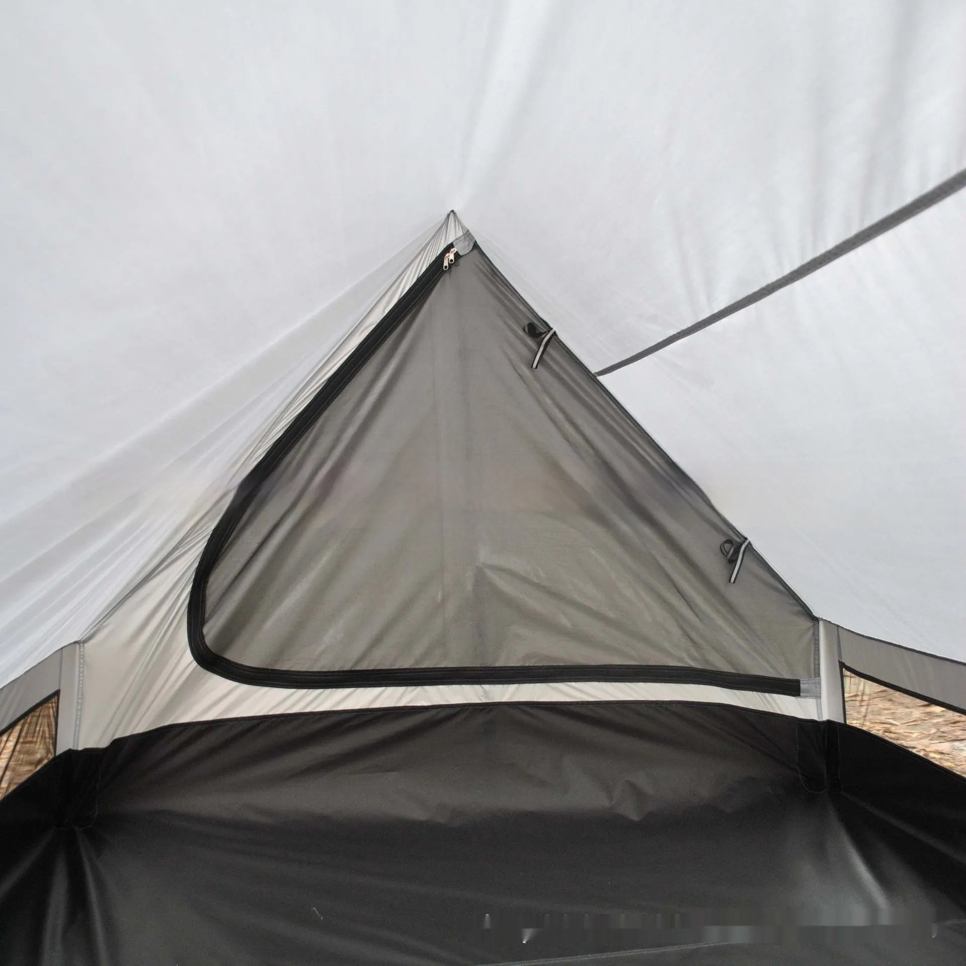 Brown A-line pole-free portable tent with hiking cane support showing interior space for 2-3 people
