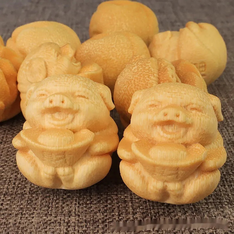 Solid bamboo carving ornament with cute pig ingot design measuring 4cm in height