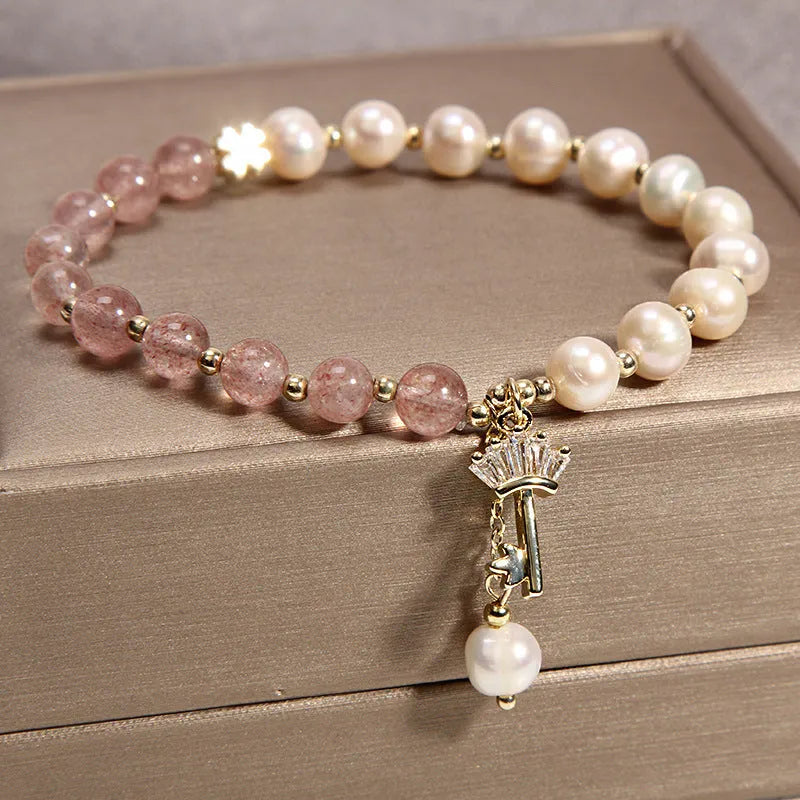 Women's multi-layer crystal bracelet with natural garnet, strawberry quartz, and moonstone pendants in Korean style.