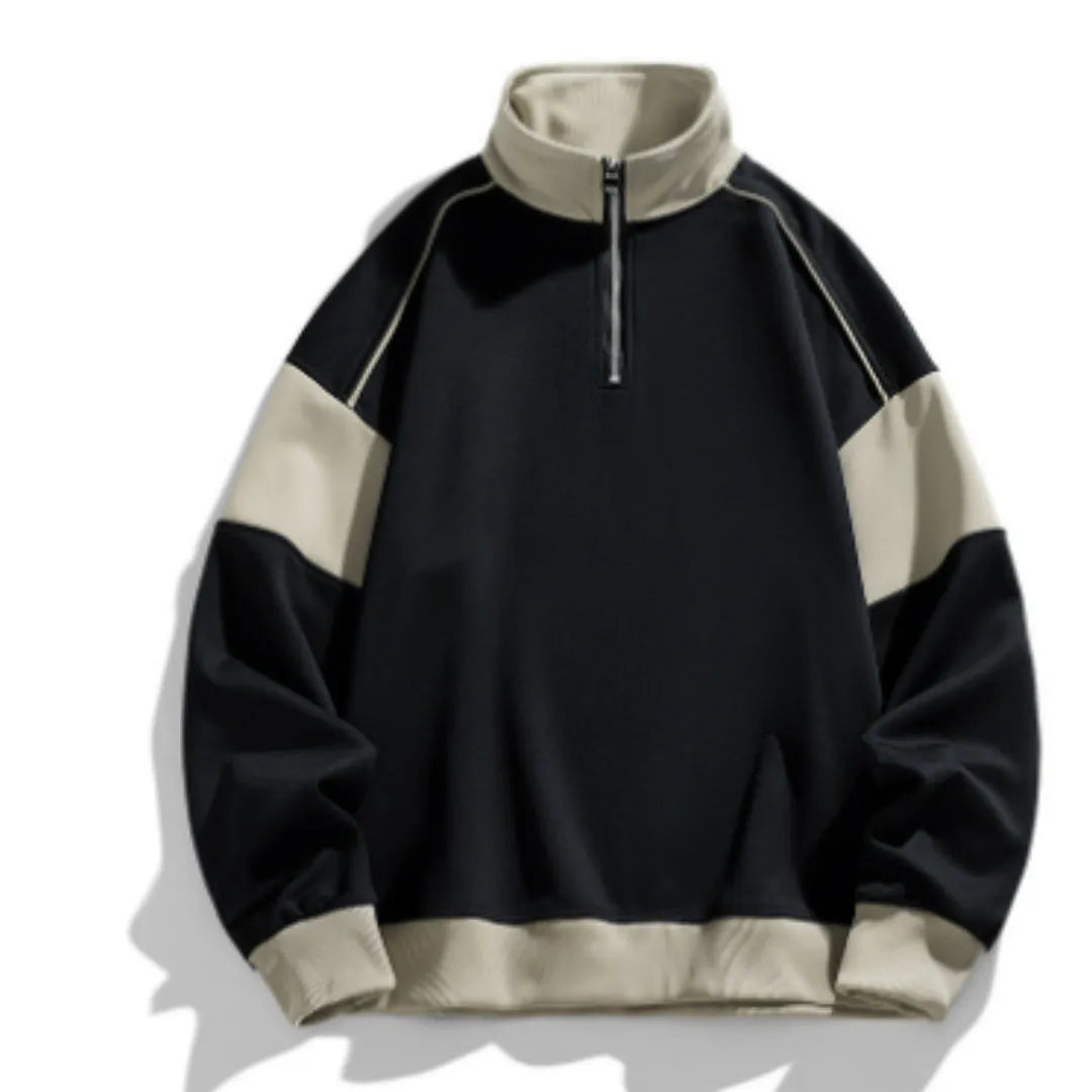 Man wearing a beige corduroy drop shoulder hoodie with loose lapels.