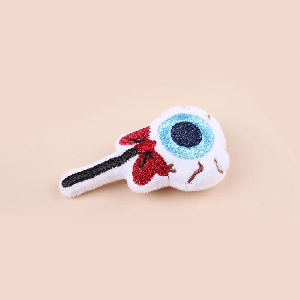 Small cat teaser wand with a soft plush head in eyes, candy, or skull design