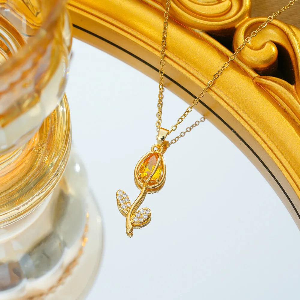 Gold-coloured tulip flower pendant necklace on a titanium steel chain for women.