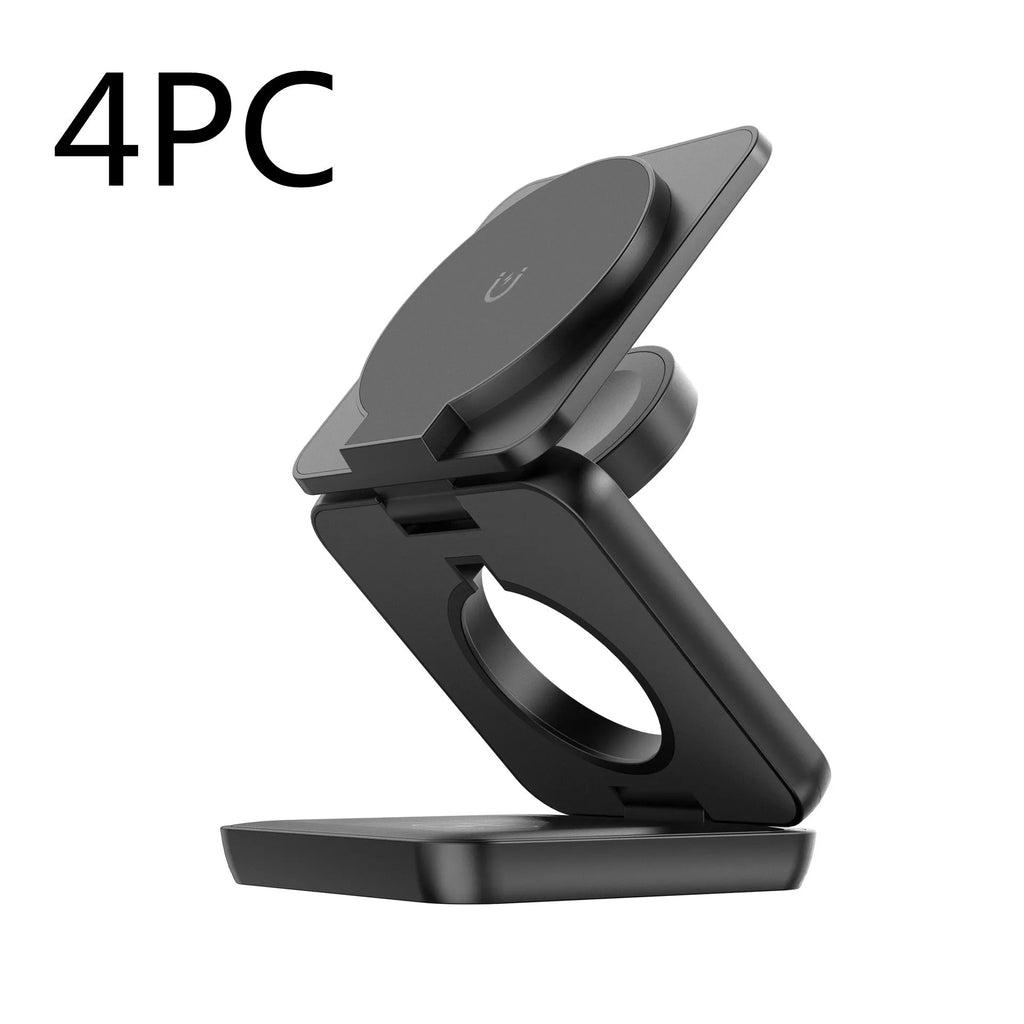 White foldable magnetic wireless charging phone stand on a wooden desk next to a mobile phone.