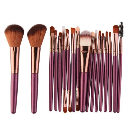 18-piece makeup brush set with fan brushes arranged on a table.
