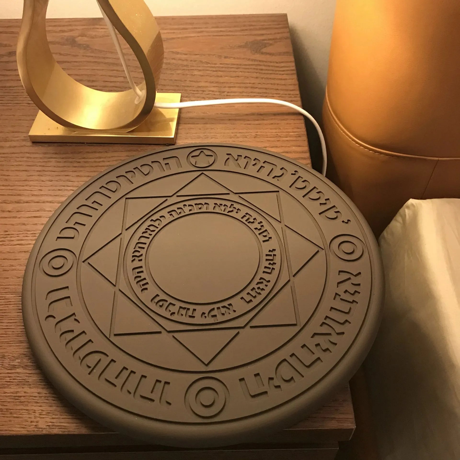 Square wireless phone charger with glowing magic array pattern measuring 25cm with thin 1.5cm profile