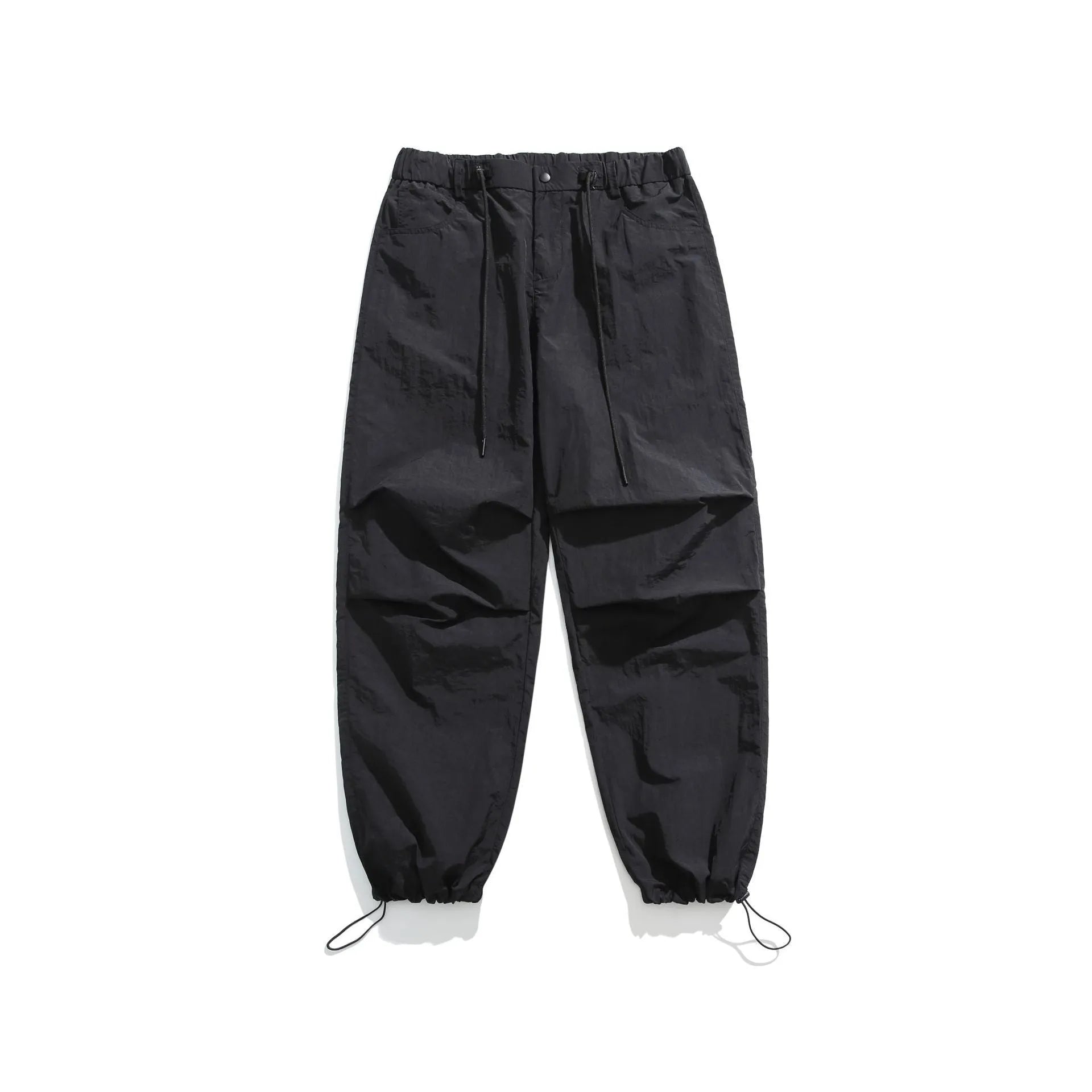 Man wearing loose straight-leg casual trousers in thin ice silk nylon fabric, showing apricot colour option.