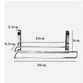 Silver stainless steel paper towel rack mounted on a kitchen cabinet door