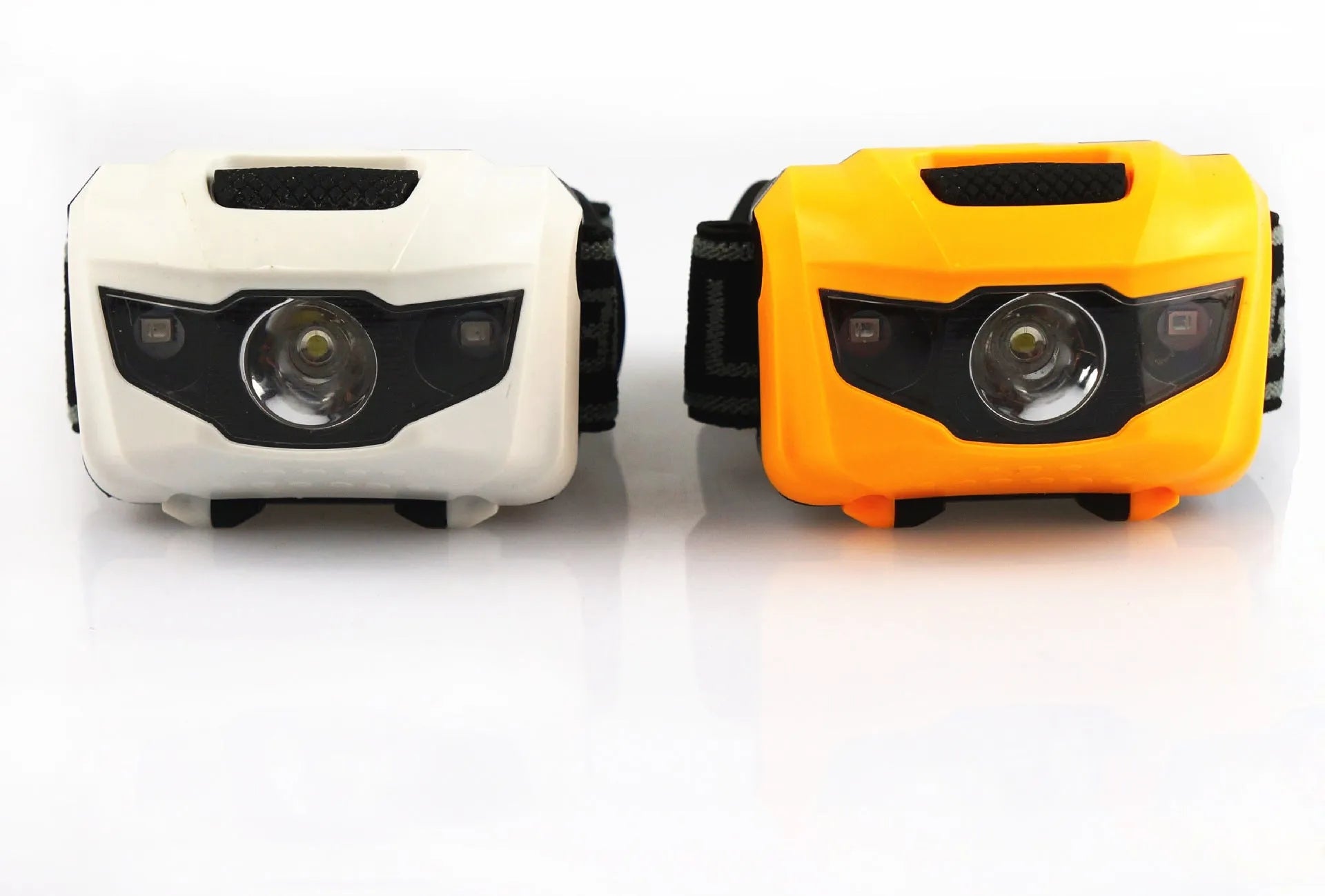 Black LED head torch with adjustable strap, showing white and red LEDs, for outdoor activities.