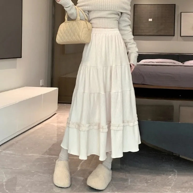 Corduroy A-line midi skirt with elastic waistband in milky white colour showing Korean style design
