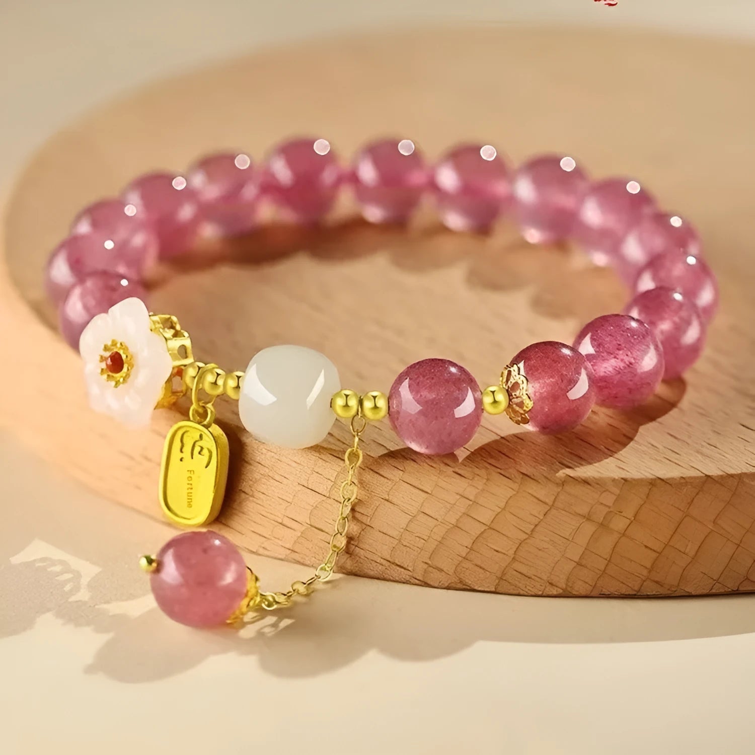 Handmade strawberry quartz crystal bracelet with hetian jade peach blossom elements in five style variations