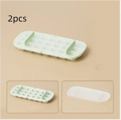 Yellow high-capacity ice cube tray with grid design and a storage slot for an ice shovel.
