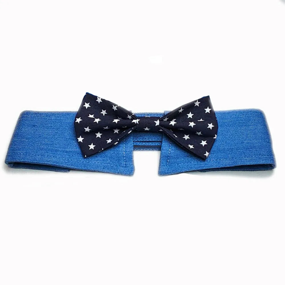 Blue denim adjustable dog collar with a black bow tie featuring white star patterns.