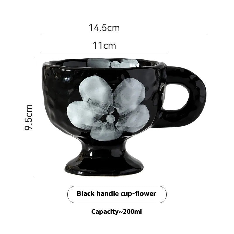 Hand-pinched irregular shaped ceramic mug in solid colour with modern simplicity design