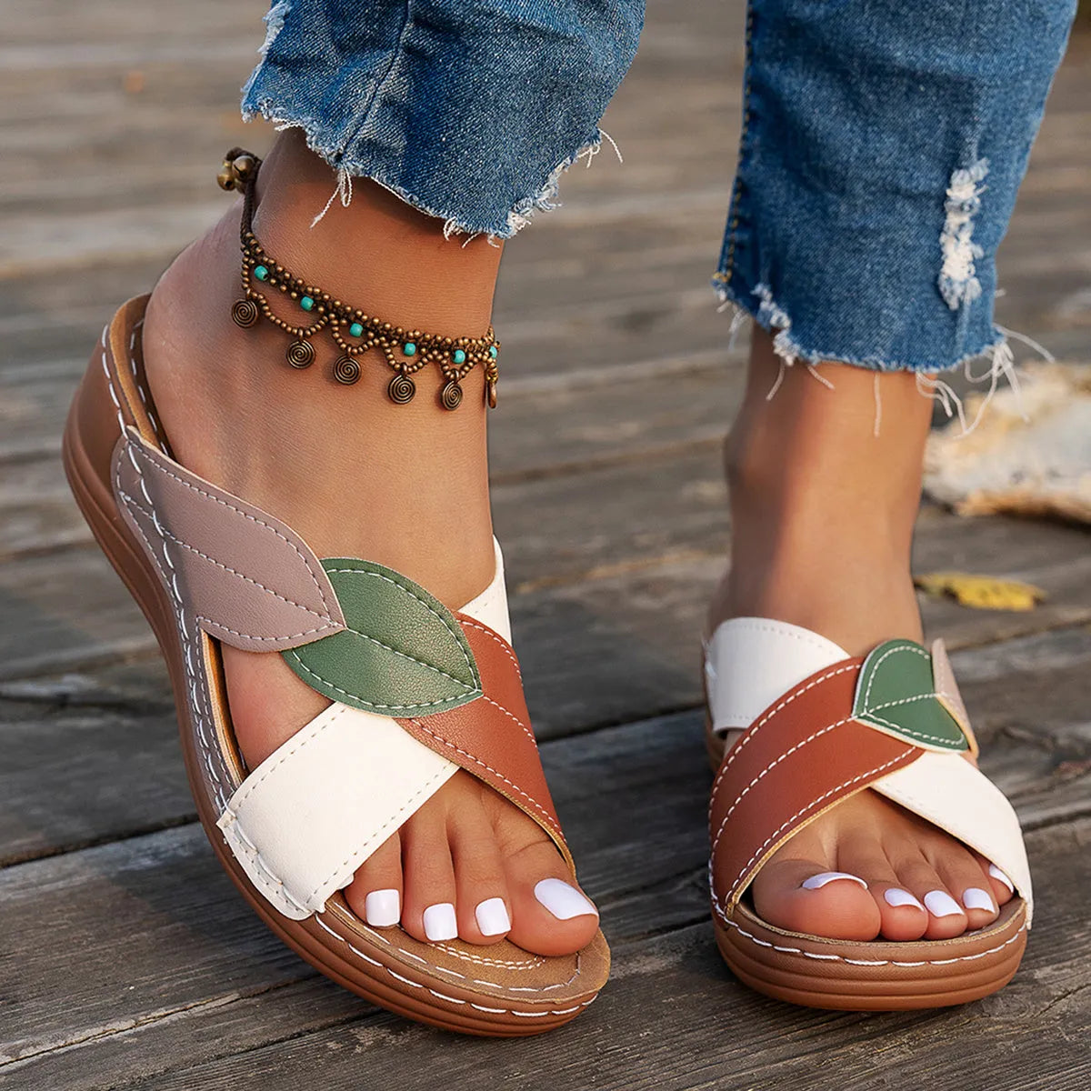 Women's red-brown cork wedge sandals with leaf design and gladiator lace-up ankle strap