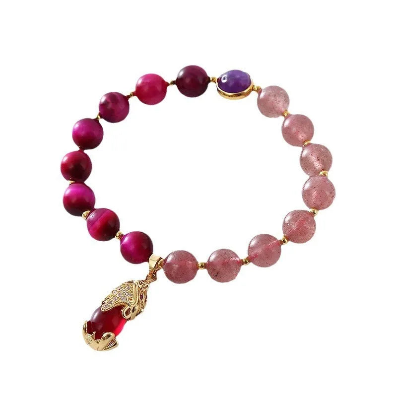 Strawberry crystal bracelet with elastic rope on wrist showing 18cm circumference