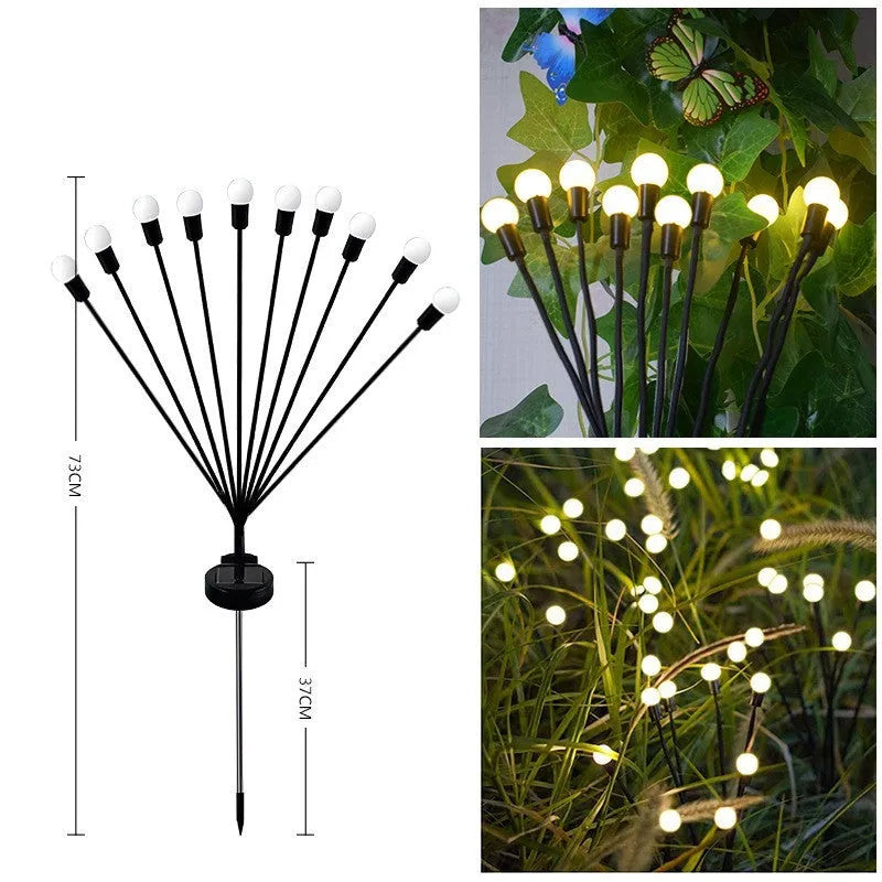 Solar-powered LED firefly lawn light with ground stake inserted in grass