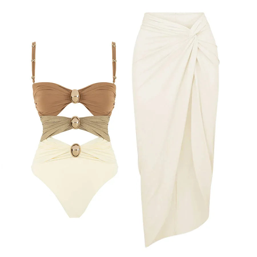 Women's solid-colour one-piece swimsuit with gold button and matching skirt in assorted colours.