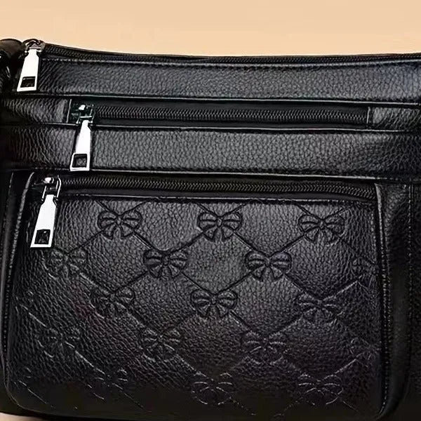Butterfly black PU leather women's crossbody messenger bag with embossed design and horizontal square shape