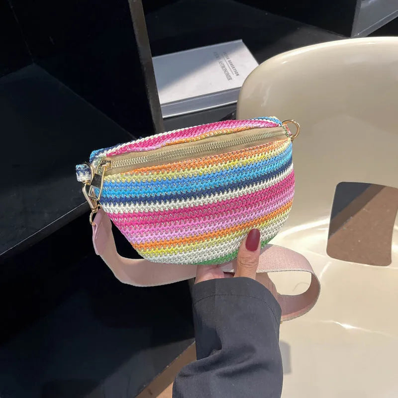 Bohemian style straw beach bag with woven construction, shell shape, and single shoulder strap