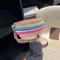 Bohemian style straw beach bag with woven construction, shell shape, and single shoulder strap