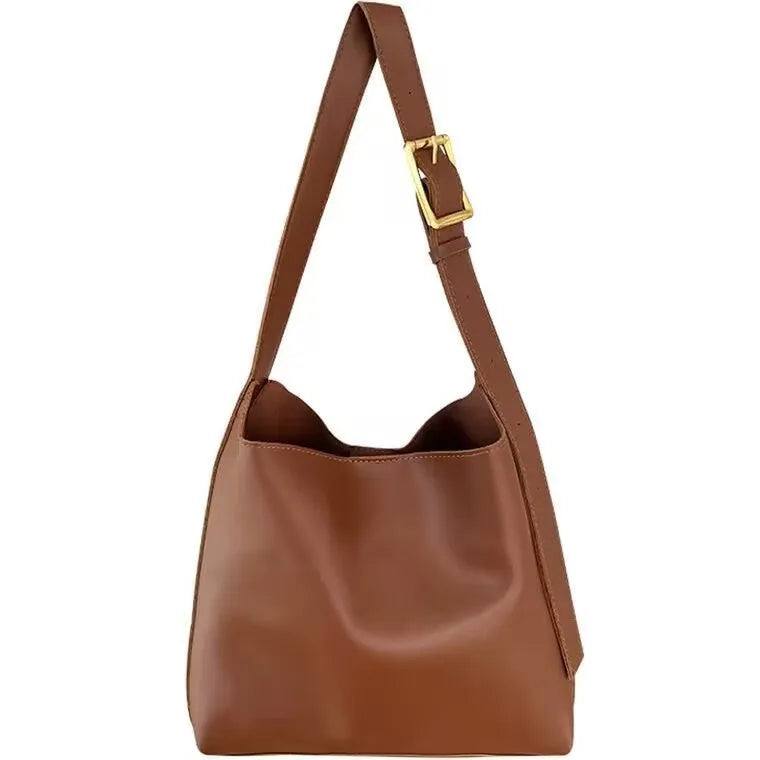 Women's soft PU leather shoulder bag with swing threads in black and brown colours showing ribbon and pocket detailing