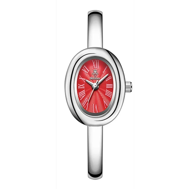 Women's slim oval retro quartz watch in gold colour on wrist