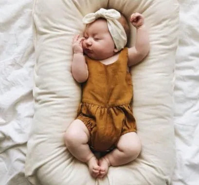 Portable cotton baby nest crib measuring 75x45cm with PP cotton filler in beige colour