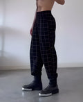 Men's plaid trousers with front apron detail in plaid pattern available in multiple sizes
