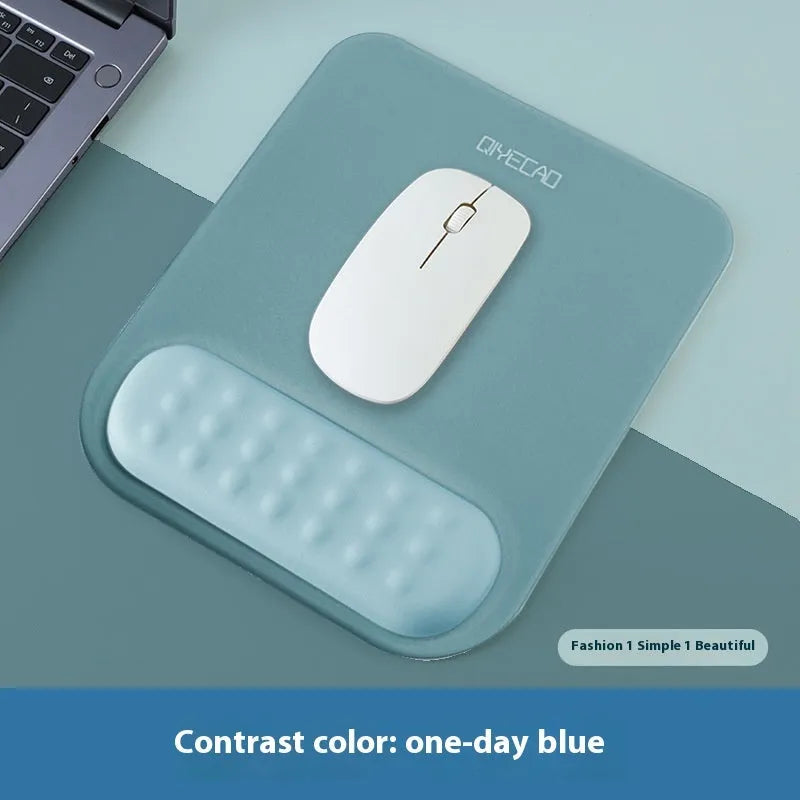 Ergonomic cloth silicone mouse pad with raised wrist support in mint green colour.