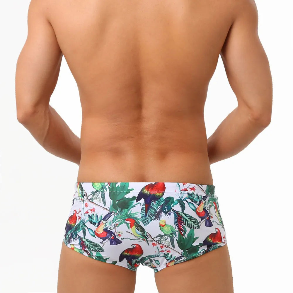 Men's floral print nylon swimming trunks with a cup cover, shown in the 619 flowers and birds colour pattern.