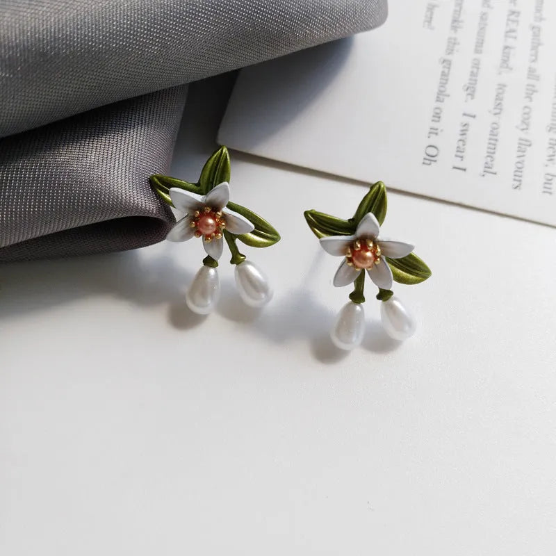 Alloy camellia flower earrings with sterling silver needle detailing for women