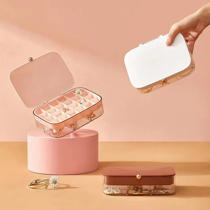 Green minimalist jewelry storage box with multiple layers for organised accessory storage