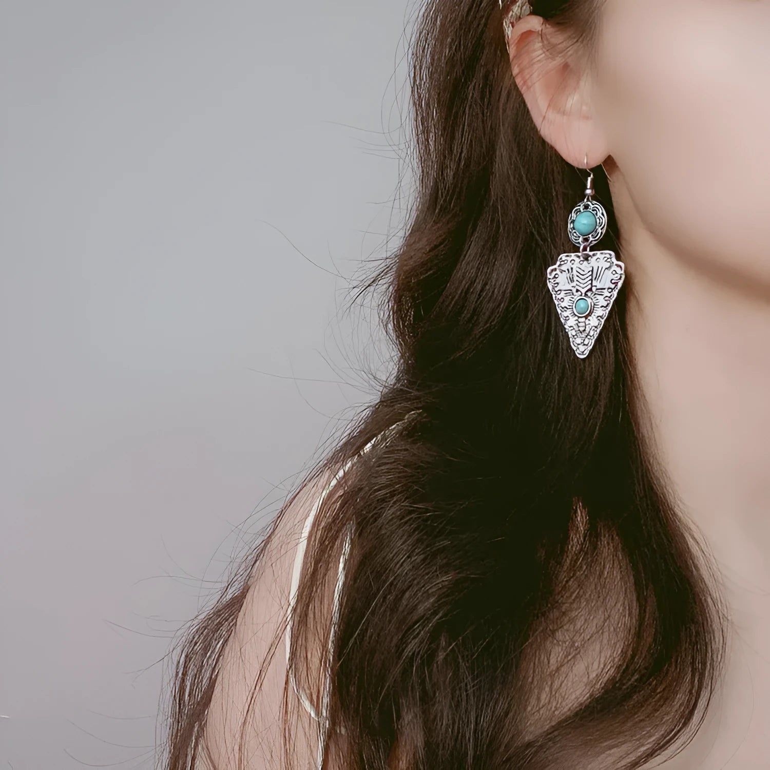 Pair of retro alloy earrings for women in triangle style with national design for travel and photo outfits.