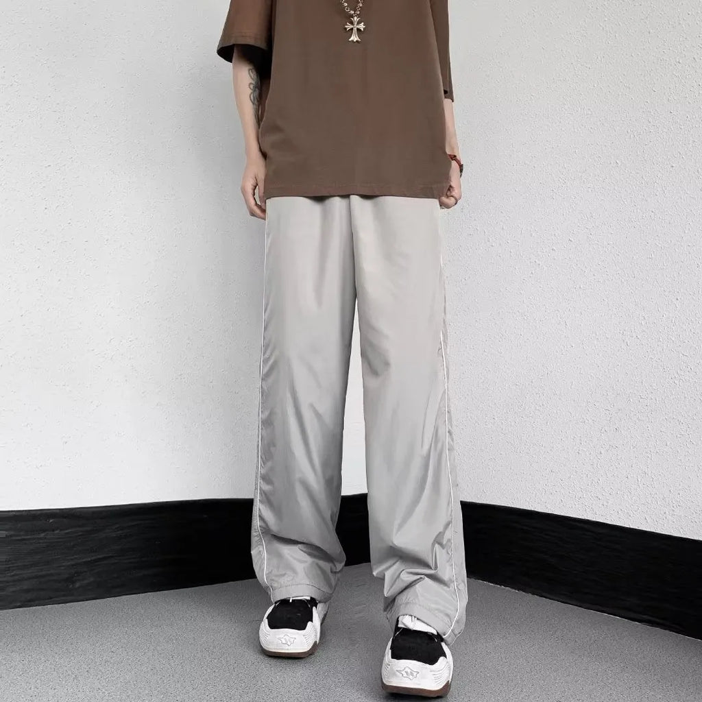 Men's navy blue wide leg striped casual pants made from lightweight polyester fabric, suitable for summer