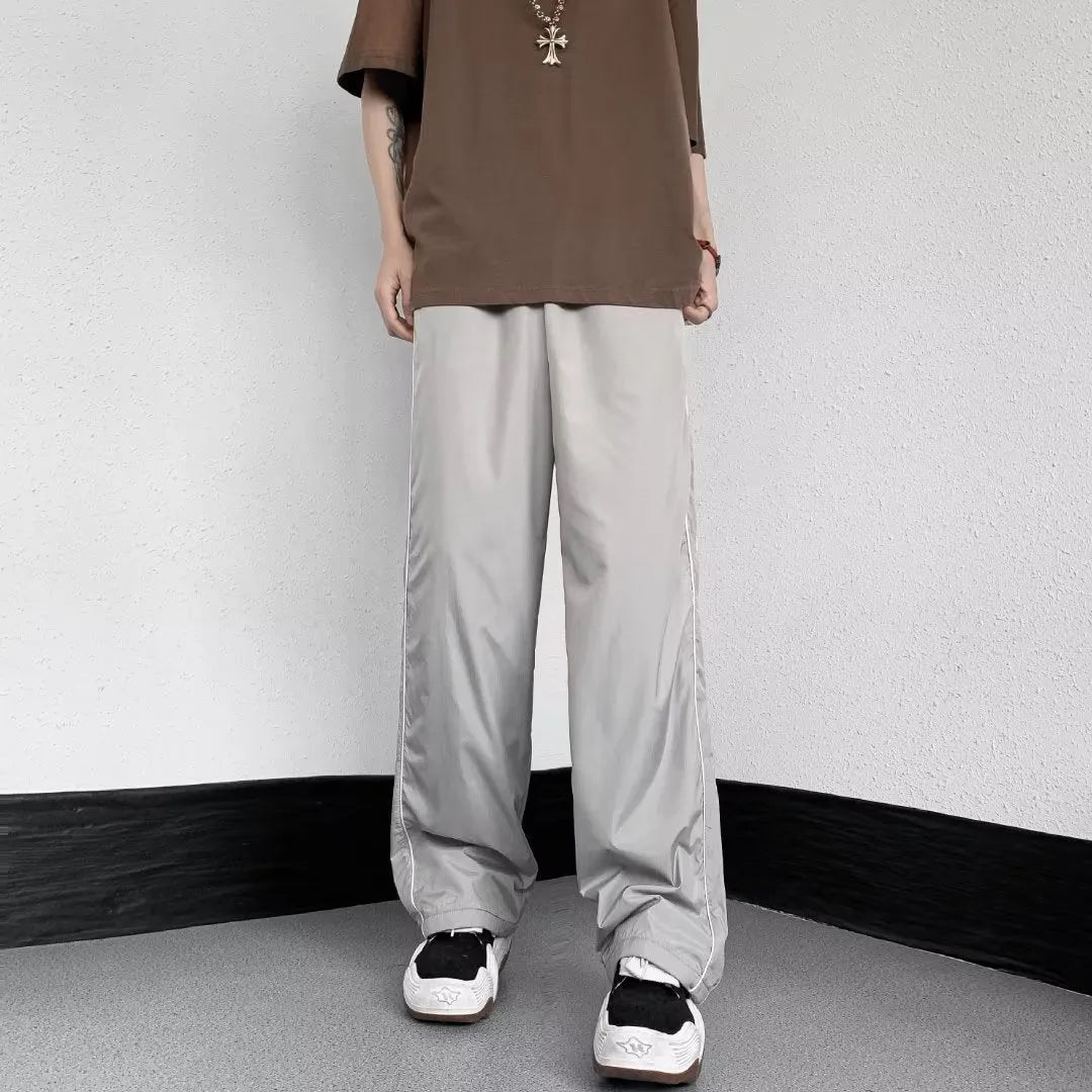 Men's navy blue wide leg striped casual pants made from lightweight polyester fabric, suitable for summer