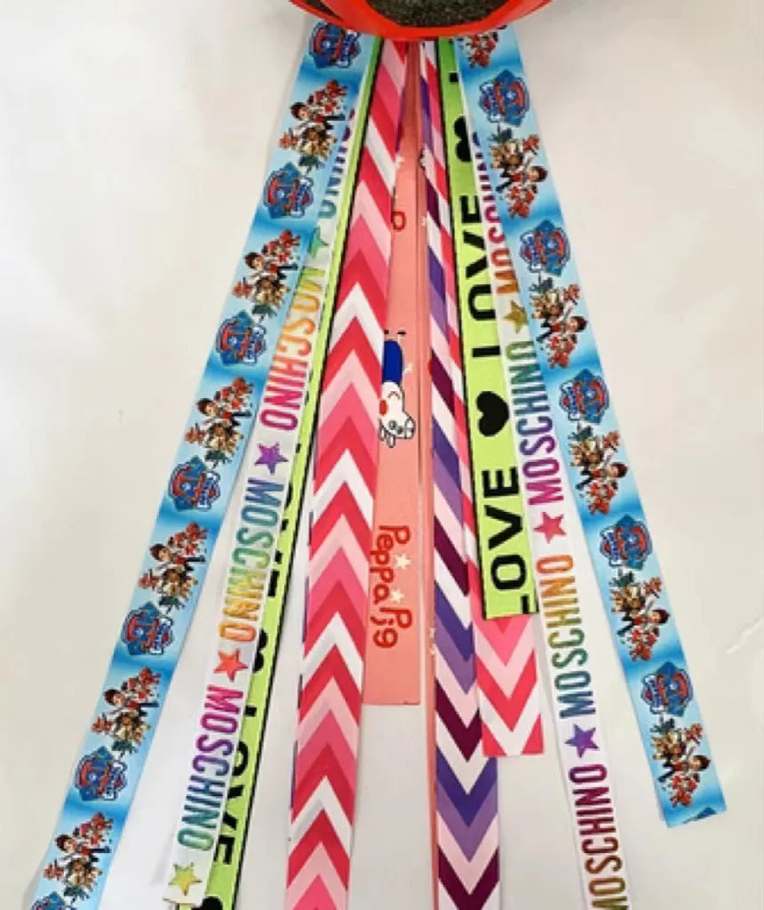 A colourful helmet streamer accessory for children's sports helmets and doll decoration.