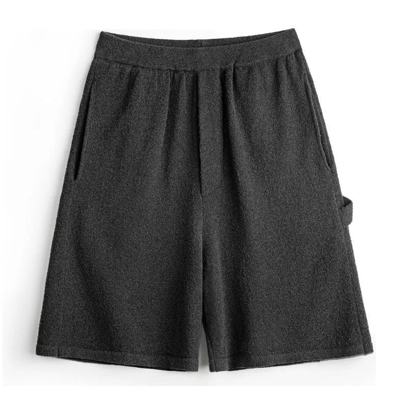 Heavy gray polyester sports shorts with straight leg design and elastic waistband