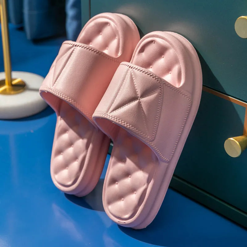 Pair of thick-soled EVA bathroom slippers in various colours, showing non-slip sole texture.