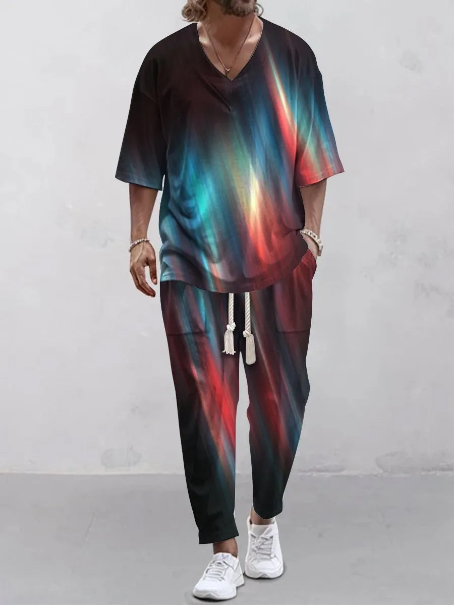 Thin polyester trousers suit with V-neck cropped sleeve jacket and matching trousers on a hanger.