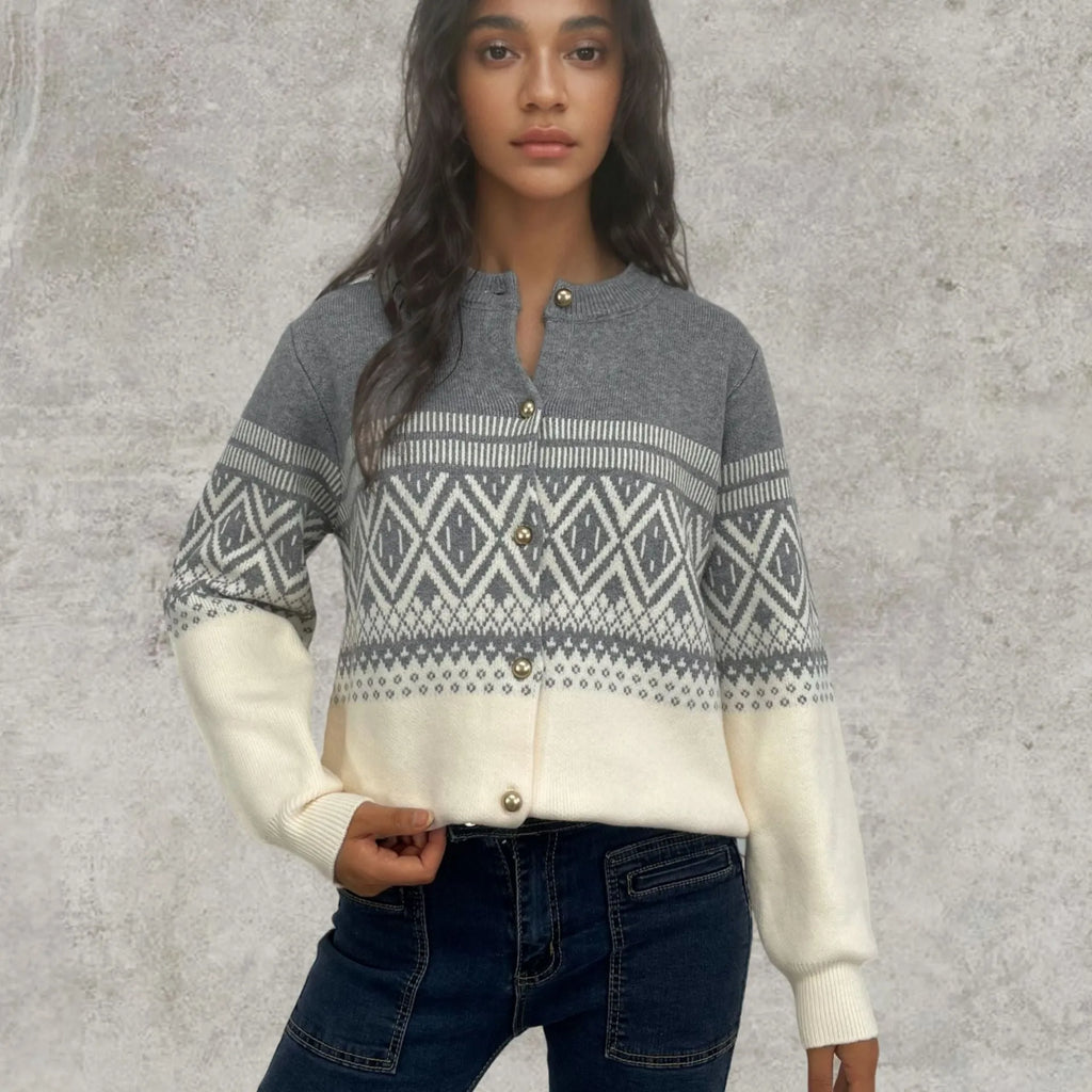 Women's red alpaca wool cardigan with diamond knit pattern and contrast colour long sleeves.