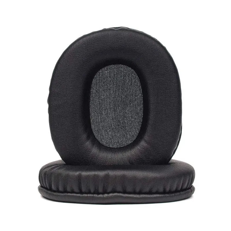 Two black PU leather headphone covers for Sony 1R headphones on a flat surface.