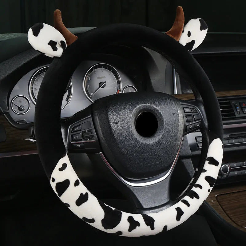 Short plush car steering wheel cover with protective handle in black colour showing 38cm diameter measurement