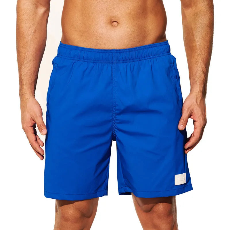 Men's quick-drying nylon sports shorts in blue with straight leg opening for beach and gym wear