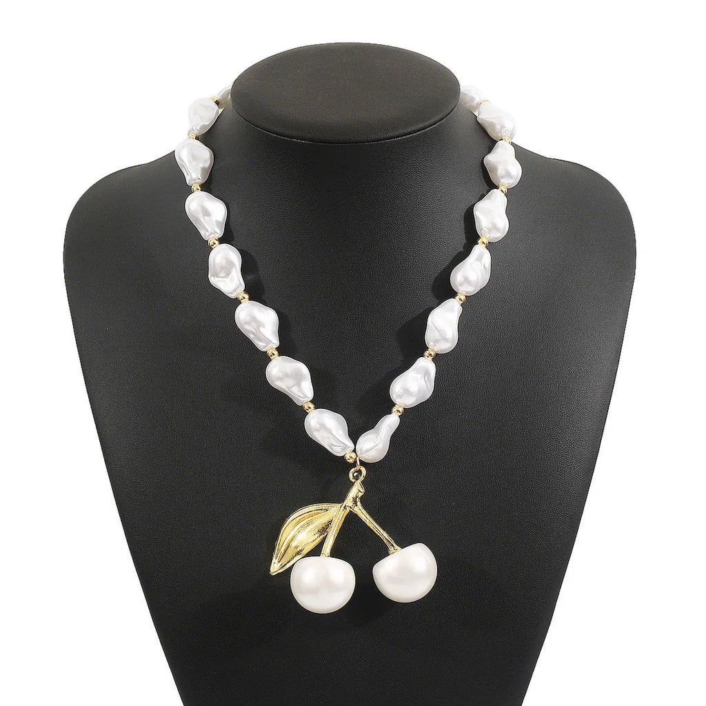 Women's geometric cherry fruit pendant necklace with pearl chain in gold or white K electroplated finish
