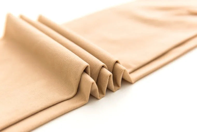 Beige and black stovepipe compression socks for hip and abdomen support