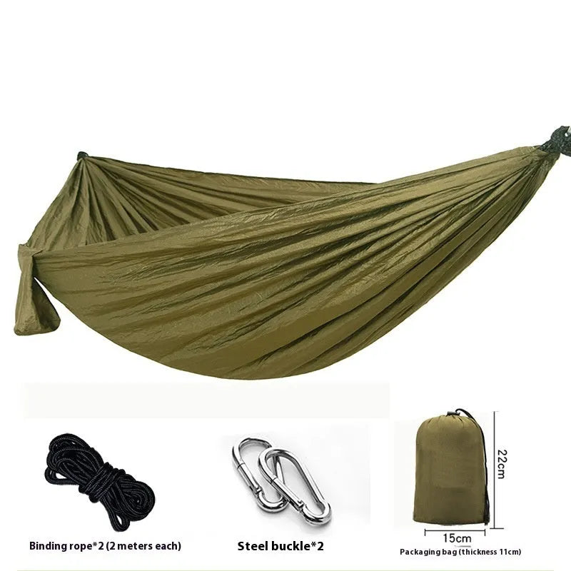 Double camping hammock with ropes and buckles shown in outdoor setting