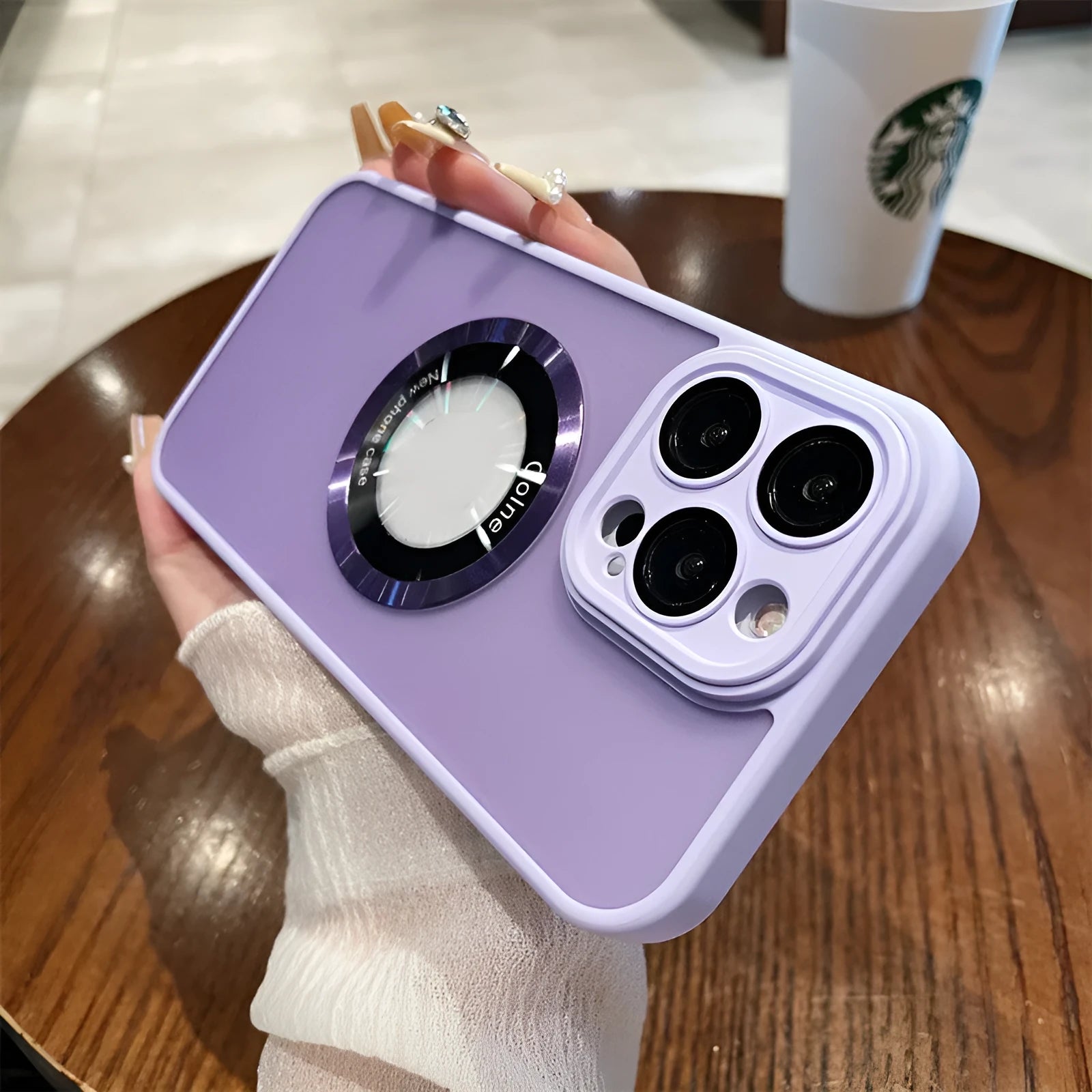 Frosted blue magnetic shockproof phone case for Apple iPhone 15 Pro Max shown on a table.