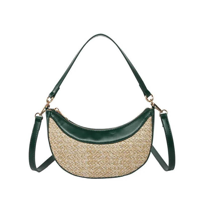 Hard structured straw dumpling shaped women's crossbody shoulder bag in black with contrast stitching.